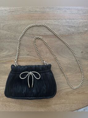 Black Pleated Bag with Bow Accent